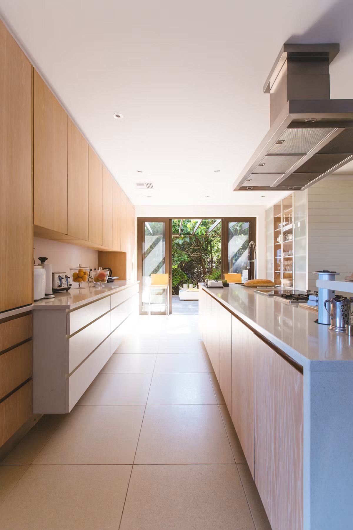 A long galley kitchen in pale oak